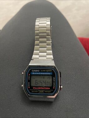 Casio Silver Digital Watch with Black and Blue Accents